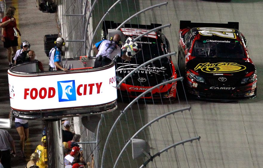 (Left to right) Kyle Busch beats Joe Gibbs Racing teammate Joey Logano to the finish line by .019 seconds, the closest NASCAR Nationwide Series finish at Bristol Motor Speedway, on Friday in the Food City 250. Credit: Tom Pennington/Getty Images for NASCAR